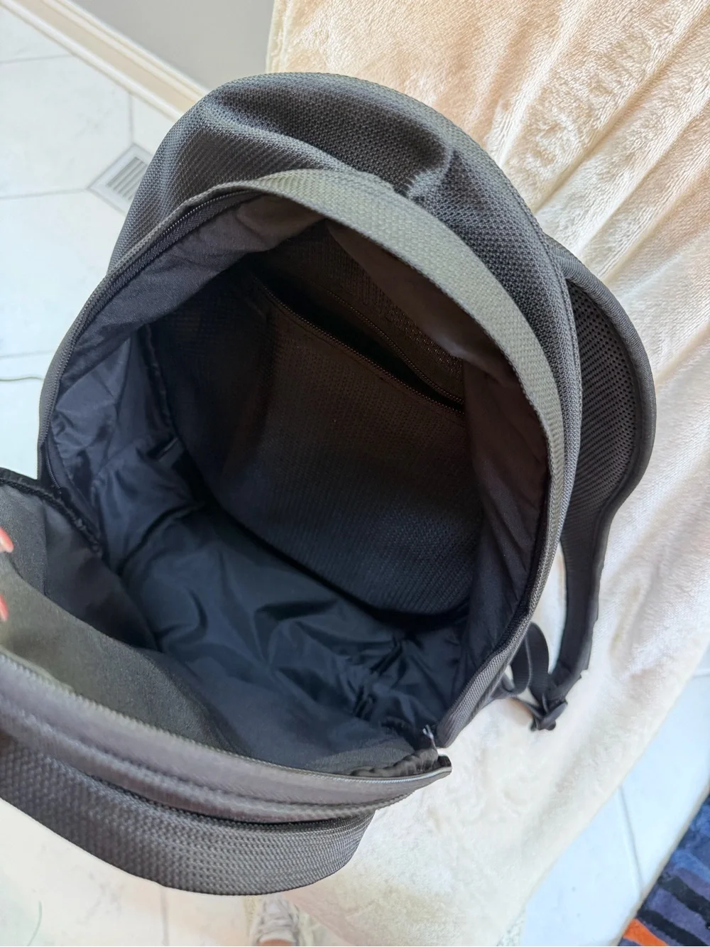 Tumi Black Backpack for Men or Women with Red Logo Accent
